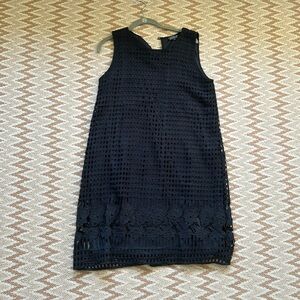 Black 90’s style dress with square and floral details.